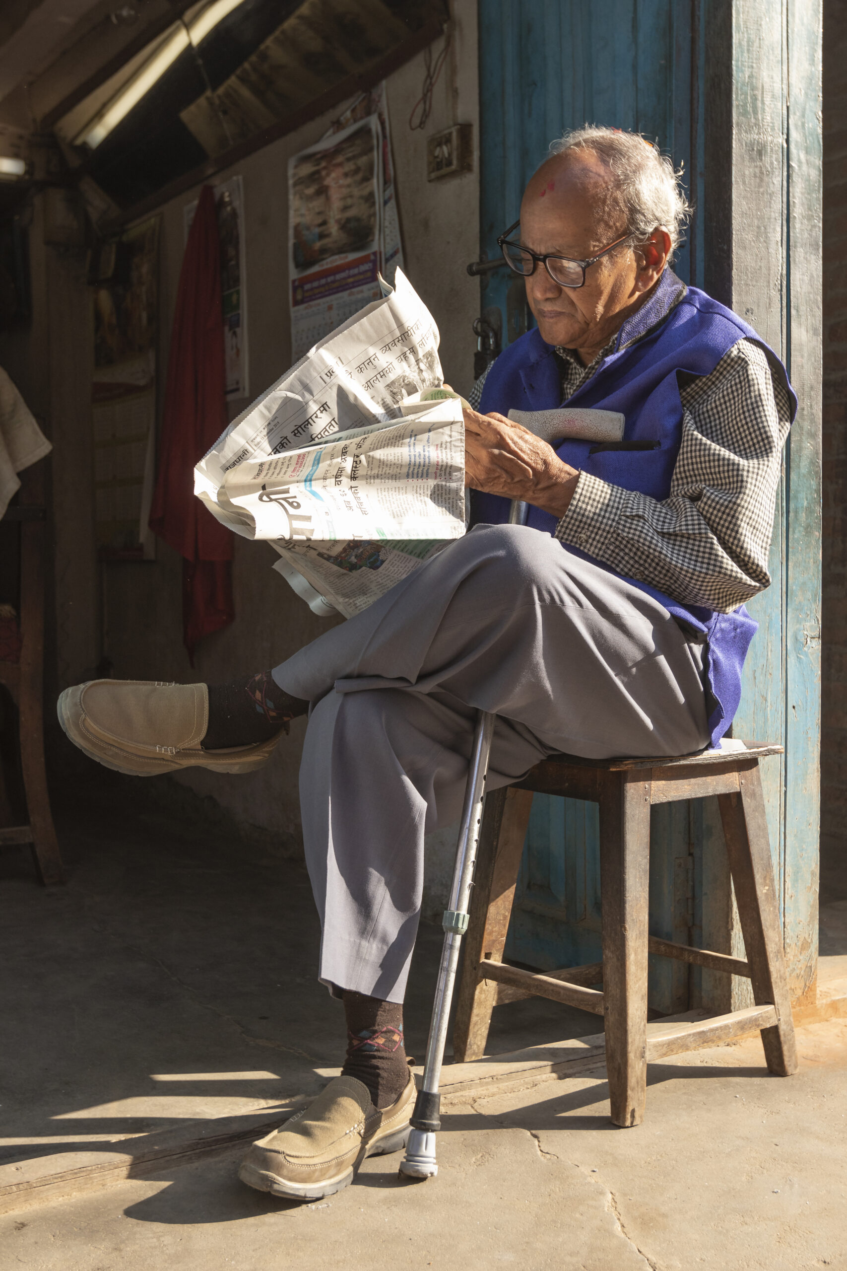 Old Man Reading News Paper